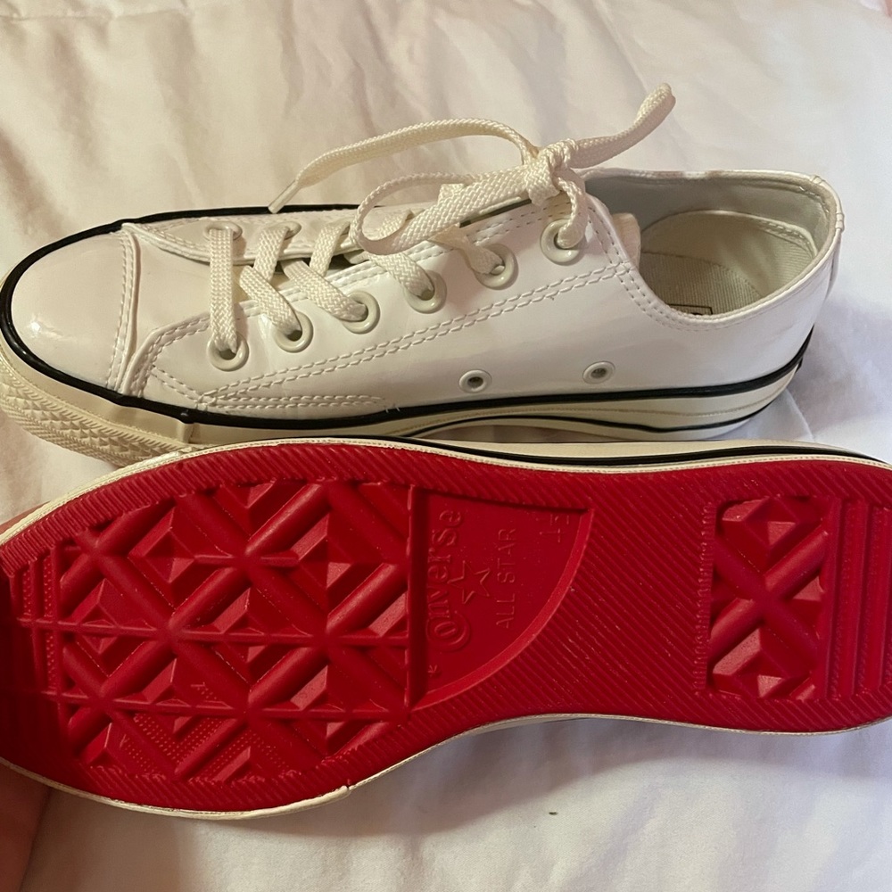 Low rise converse with red bottoms